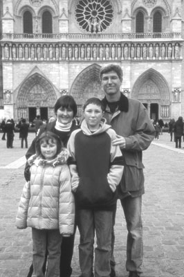 Parents Alan and Joanne Saunders pose with Max and Taylor in front of Notre Dame.