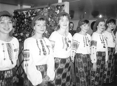 Young Ukrainian waitresses wearing native costumes for a special dinner aboard the Lavrinenkov.