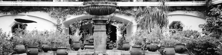 The beautiful fountain in the courtyard of the Hotel Santo Tomás in Chichicastenango with a small Mayan band above on the walkway.  I had a very pleasant lunch on one of the gallerias. The fountain and music provided a very pleasant backdrop.