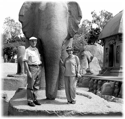 Jan and Chuck stand at the side of an elephant sculpture at the Panch Rathas complex in Mamallapuram.