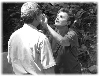 Maria adorns her husband, Jorge, with the therapeutic mud found in the thermal waters of El Valle, located in a high mountain valley.