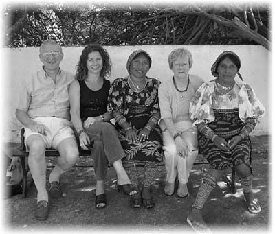 Jim, Susan and Nancy Simpson join two Kuna Indian women taking a break from selling their molas. 