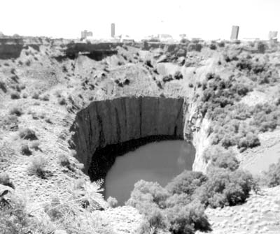 The famous Kimberley diamond mine (no longer being mined), with the city of Kimberley in the background. 