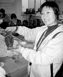 Tour director Sheila Li Tan explained cloisonné art to our group.