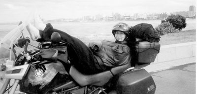 Here I am resting at Punta del Este, Uruguay, from which, heading south, it got cooler every day. (On the back of our motorcycle, the right saddlebag held my luggage while the left held Dean’s; the bin on top contained chains and bike supplies, and we strapped on a small day pack for outings.) 