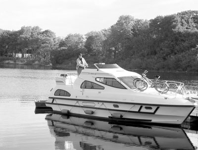 Lew Toulmin docks a Consul-class motorboat at the southeast end of Lough Ree.