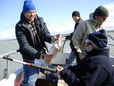 Boat hand displays Rosemary Frueh’s catch in Sauðárkrókur Harbor.