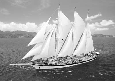 The barquentine Mandalay under full sail. Photo courtesy of Windjammer Barefoot Cruises