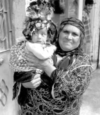 A mother proudly showing us her baby daughter — Deir ez-Zor.