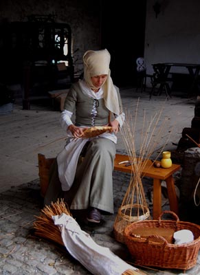 A member of the “1479” re-creators’ group demonstrates reed weaving — Marksburg Castle, Braubach, Germany.