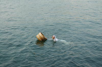  An ama, or pearl diver, with an oyster at Mikimoto Pearl Island. 