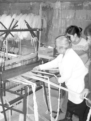 At this small carpet factory, all carpets are made on traditional looms.