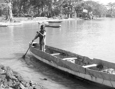 A local near the landing dock in Juffureh. In the background are the ruins of a 17th-century, French-built, fortified slaving station. Photos: Wirtanen