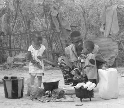 A Juffureh family cooking breakfast.