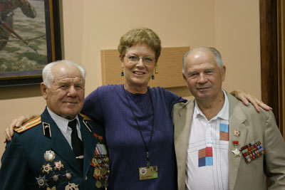 Paula Prindle makes new friends with these WWII veterans. Photo: David Prindle