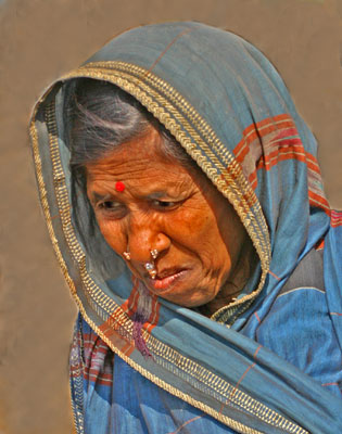 One of the more well-off Orissan women, dressed in a sari with jeweled nose adornment.