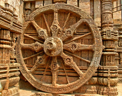 One giant wheel of the 12 pairs on the chariot of the sun god at Konark.