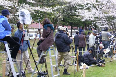 Photographers claim space horizontally and vertically along the course well before the running of the yabusame.