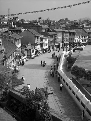 Colorful shops and restaurants surround the 17th-century Bodhnath Temple.