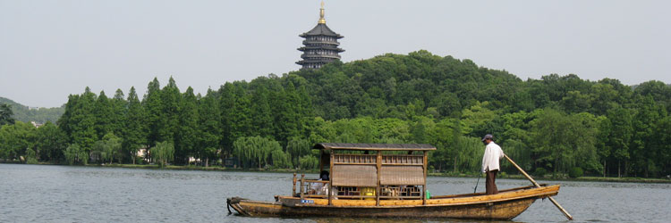 Ferry at the West Lake Scenic Zone, with Leifeng Pagoda in the background — Hangzhou.