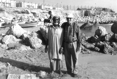 Wayne Schild and a fisherman in Sur, Oman.