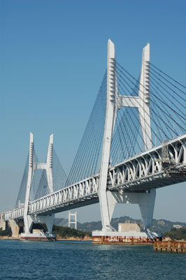 Iwakurojima Bridge is one of six sections making up the Seto Ohashi Bridge, which links the islands of Honshu and Shikoku in Japan. The central span is the longest combined road and rail bridge in the world. Photos by David Tykol.