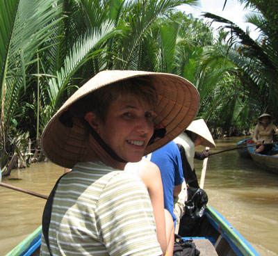 Inga Aksamit being rowed down a canal.