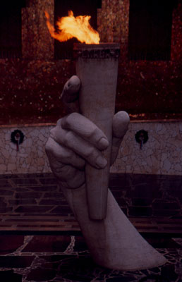 A sculpted hand holds an eternal flame to commemorate soldiers killed in the defense of Stalingrad — Mamaev Kurgan complex, Volgograd.