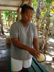 Ann Singeo explained the medicinal benefits of a sprouted coconut. Photos: Scott