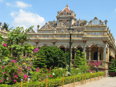 Vinh Trang Pagoda in the city of My Tho, Vietnam, is still an active temple with resident monks and local worshipers.