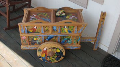 A real conversation piece, this small, decorative ox cart graces our porch. Photo: Goch