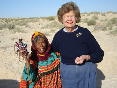 A Bedouin woman selling handmade jewelry in the desert paused for a photo with Jean Nethery.