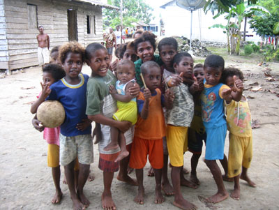 Island kids greeted us as we disembarked on our way to see the rare Red Bird of Paradise.