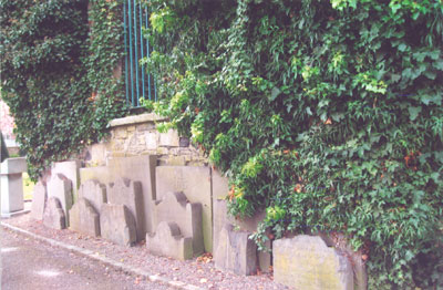 Tombstones huddled together against the wall of the ruined early-medieval Church of St. Kevin.