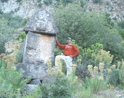 Douglas Praksti and one of the many, 2,500-year-old Lycian sarcophagi scattered around Pinara.