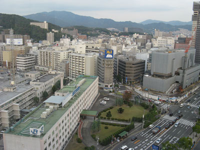 A view of the transportation hub in Hiroshima City which offers access for buses, streetcars, taxis, trains and bikes plus a shopping center.