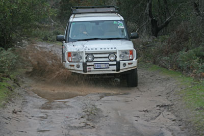 Peter Morris, our guide with Kangaroo Island Wilderness Tours, driving along a muddy track.