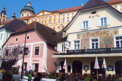 In the charming town of Melk, we stayed the night in a room above the restaurant shown here, framed by Melk Abbey in the background.