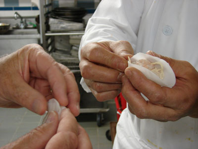 Chef Wah shaping purse-like shrimp dumpling. 