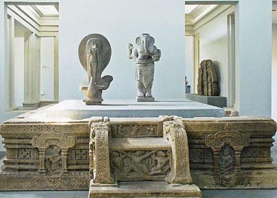 A gallery in the Cham Sculpture Museum displays reliefs and an image of the Hindu deity Ganesha.