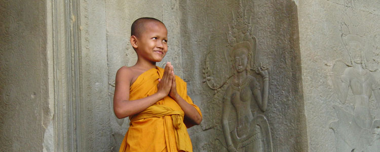 A young Buddhist monk greets us at the main temple in Angkor Wat near Siem Reap, Cambodia.