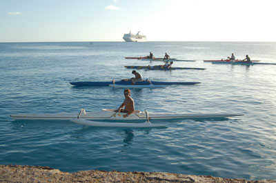 Locals at Rangiroa waiting to ride the wake from the tenders bringing passengers to the shore.
