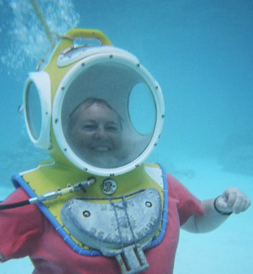 Taking the underwater walk at Moorea, Society Islands. My hair is wet only because I snorkeled while awaiting my turn.  No water gets into the helmet while the air is on.