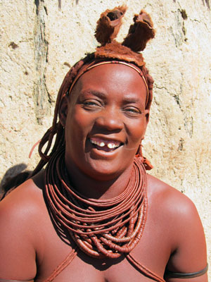 Himba women, like this one, cover themselves with a mixture of butter fat, ochre and herbs. Photo by Jim Hendrickson