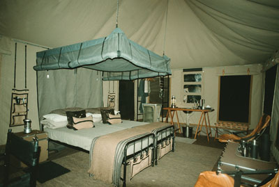 Interior of a guest tent in the Singita Explore mobile tented camp — Grumeti Reserves.