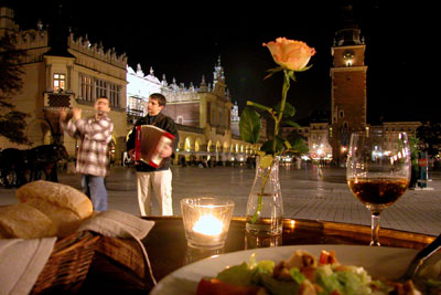 The sidewalk cafés lining Kraków’s Main Market Square offer the best seats for taking in the city’s street theater.