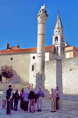 Pictured behind the Pillar of Shame, in Zadar’s historic Old Town, is an ancient Venetian wall and the cathedral tower bell.