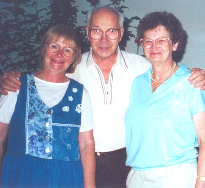 Researcher Dezso and his wife, Kinga (left), with Norine Matteson.