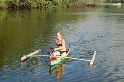 A visitor paddling on the river.