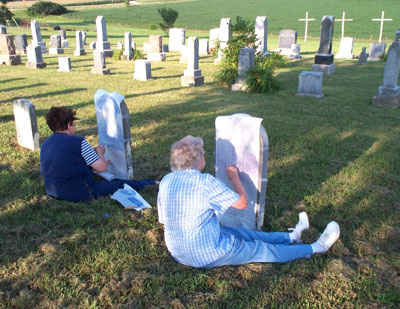 Carol Ann Nulk and cousin Jean making a rubbing of a Bauer family tombstone at St. Paul’s Lutheran Church cemetery in Falls City, Nebraska. Photo: Bob Nulk